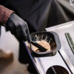 Person Holding Black Ceramic Bowl